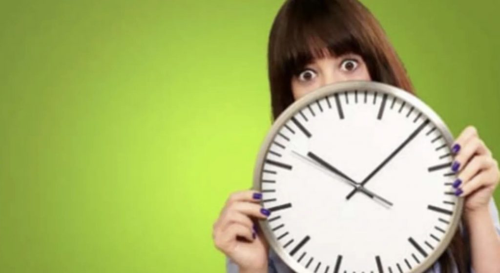 Girl Holding Clock