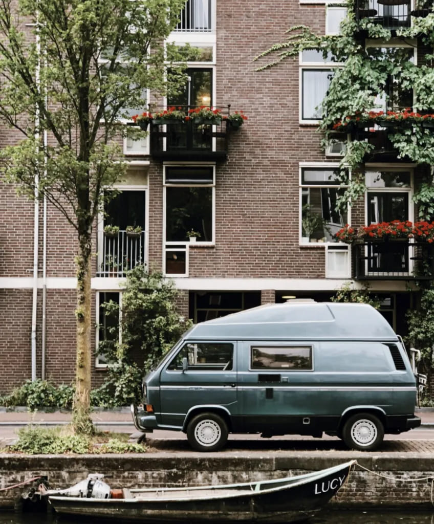 Van in Frnt of Building